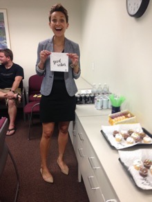 Verma at her dissertation defense; smiling and holding a